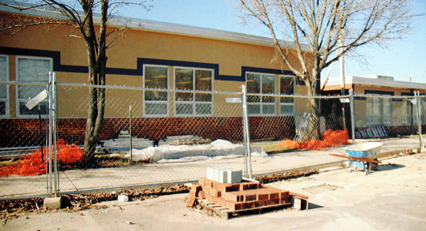 Picture of the front exterior of Navy Elementary School during renovation. The picture was printed in the school’s 2006 yearbook.