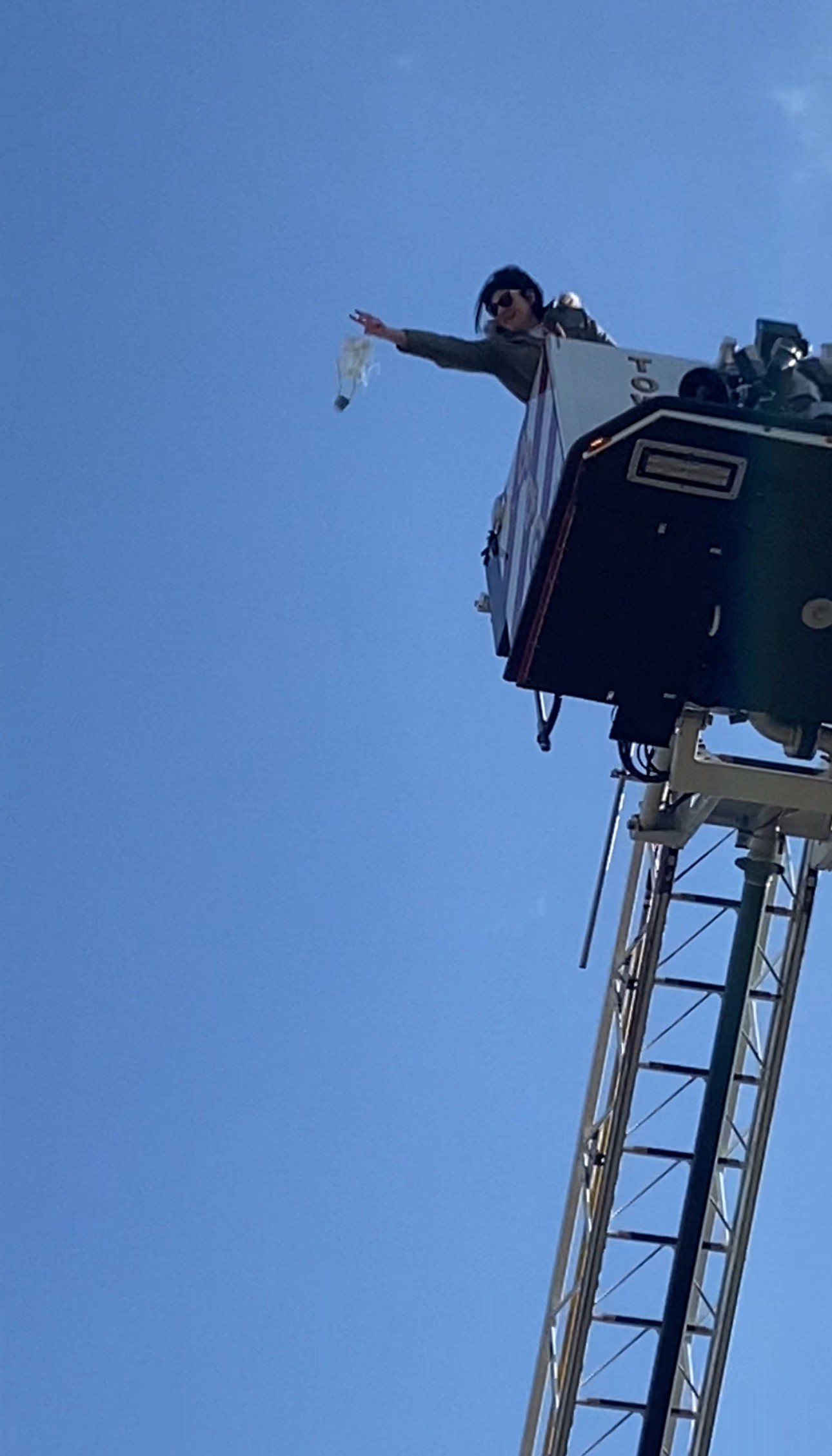 Dropping a parachute from the top of a firetruck